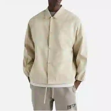 Fear of God Essentials FW22 1977 Nylon Coaches Jacket Egg shell Logo