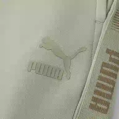 PUMA CLASSICS M FOR MELODY SWEATPANTS DK logo