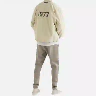 Fear of God Essentials FW22 1977 Nylon Coaches Jacket Egg shell Logo