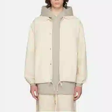 Fear of God Essentials FW22 1977 Nylon Coaches Jacket Egg shell Logo