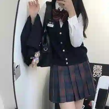 东鲸岁时记 经典学院风格纹百褶短款半身裙 圣诞红格