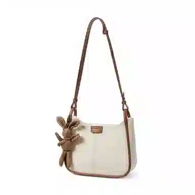 红蜻蜓 高级感简约百搭气质公仔玩偶小众设计通勤包包 牛皮 超纤合成革 单肩斜挎包 女款 米白色