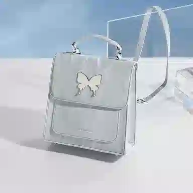 稻草人 小众蝴蝶翩翩设计高质感小众蝴蝶翩翩设计高质感 聚氨酯 手提包书包旅行双肩包 常规 女款 灰蓝/浅杏色/银灰