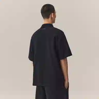 CHINISM Logo Embroidered Half-Zip Polo Shirt