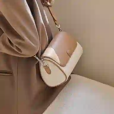纳兰杜 包包女百搭高潮流小众品牌女士包包 牛皮拼合成革 圆筒包斜挎包单肩包 小号 女款 米白拼杏/可可棕