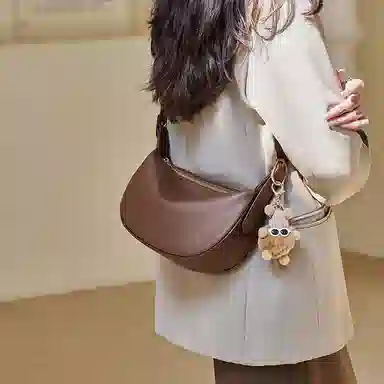 纳兰杜 包包女高颜值潮流百搭休闲高级感简约女包通勤 牛皮 饺子包新月包斜挎单肩包 中号 女款 燕麦色