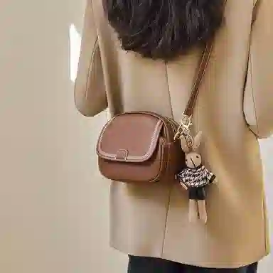 纳兰杜 包包时尚百搭通勤女士精致品牌女包 牛皮 小圆包斜挎包单肩包 小号 女款 子夜黑/米白拼棕/咖色