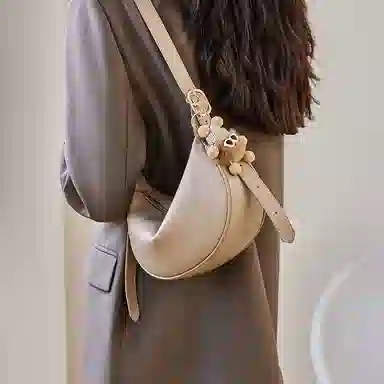 纳兰杜 包包女高颜值潮流百搭休闲高级感简约女包通勤 牛皮 饺子包新月包斜挎单肩包 中号 女款 燕麦色