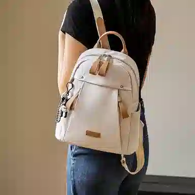 纳兰杜 大容量通勤简约百搭轻便学生党上课出游 织物拼合成革 双肩包 大号 女款 米白拼杏/子夜黑