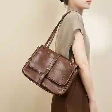 纳兰杜 包包女包时尚百搭高级感复古简约通勤包 牛皮 邮差包单肩包斜挎包 大号 女款 棕色