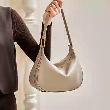 纳兰杜 时尚小众设计女包法式潮流饺子包女高级感通勤实用包包 牛皮合成革 斜挎包单肩包腋下包新月包 女款 燕麦色