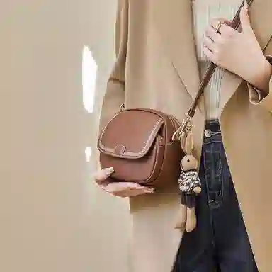纳兰杜 包包时尚百搭通勤女士精致品牌女包 牛皮 小圆包斜挎包单肩包 小号 女款 子夜黑/米白拼棕/咖色