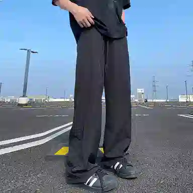 美式高街激光冲孔透气空调裤冰丝速干薄款垂感阔腿无性别抽绳工装伞兵休闲裤 男女同款 黑色