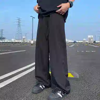 美式高街激光冲孔透气空调裤冰丝速干薄款垂感阔腿无性别抽绳工装伞兵休闲裤 男女同款 黑色