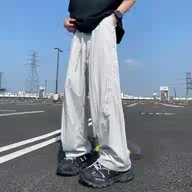 美式高街激光冲孔透气空调裤冰丝速干薄款垂感阔腿无性别抽绳工装伞兵休闲裤 男女同款 黑色