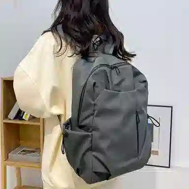 爱尔绅特 休闲纯色简约质感 涤纶 双肩包 男女同款情侣款 白色/黑色