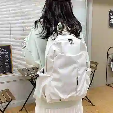 爱尔绅特 休闲纯色简约质感 涤纶 双肩包 男女同款情侣款 白色/黑色