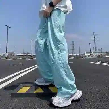 美式高街激光冲孔透气空调裤冰丝速干薄款垂感阔腿无性别抽绳工装伞兵休闲裤 男女同款 黑色