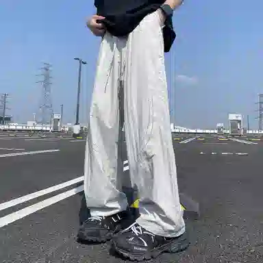 美式高街激光冲孔透气空调裤冰丝速干薄款垂感阔腿无性别抽绳工装伞兵休闲裤 男女同款 黑色