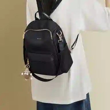 红蜻蜓 学生书包轻便时尚百搭小公仔多功能上学通勤 织物 双肩包背包 常规 女款 黑色