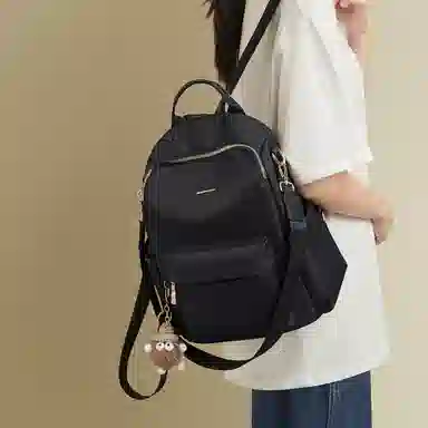 红蜻蜓 学生书包轻便时尚百搭小公仔多功能上学通勤 织物 双肩包背包 常规 女款 黑色