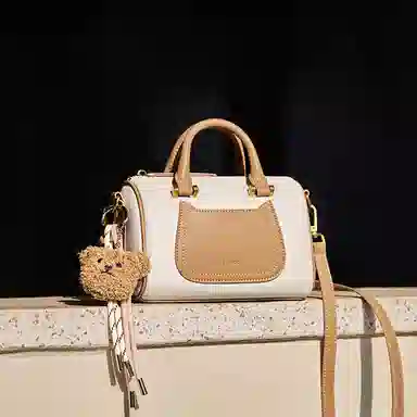 纳兰杜 上班通勤洋气高级感保龄球波士顿包 牛皮 单肩斜挎手提包 小号 女款 米白拼杏/子夜黑