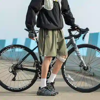 领航骆驼 美式速干透气纯色户外运动直筒休闲短裤 男女同款