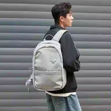 特步 纯色大容量运动时尚休闲通勤背包学生书包 织物 双肩包 男女同款情侣款 黑色/灰色