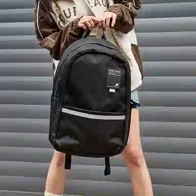 特步 纯色大容量运动时尚休闲通勤背包学生书包 织物 双肩包 男女同款情侣款 黑色/灰色