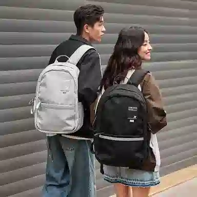 特步 纯色大容量运动时尚休闲通勤背包学生书包 织物 双肩包 男女同款情侣款 黑色/灰色