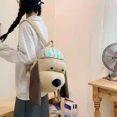 單倉 可爱搞怪小狗玩偶设计背包旅行日常通勤百搭学院风 布 双肩包 女款 卡其色