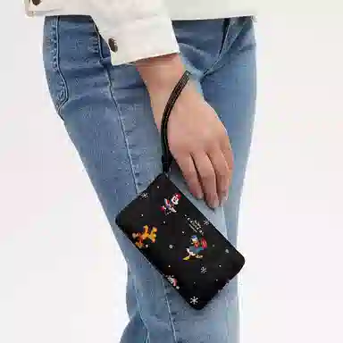COACH x Disney Corner Zip 16 Logo