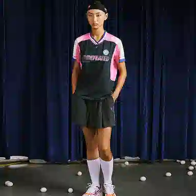 UNDEFEATED x Xuperman FW24 V-Neck Tee