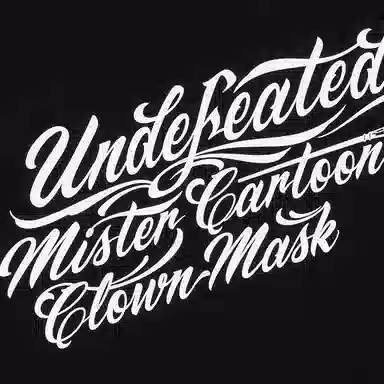 UNDEFEATED x Mister Cartoon SS25 LogoT
