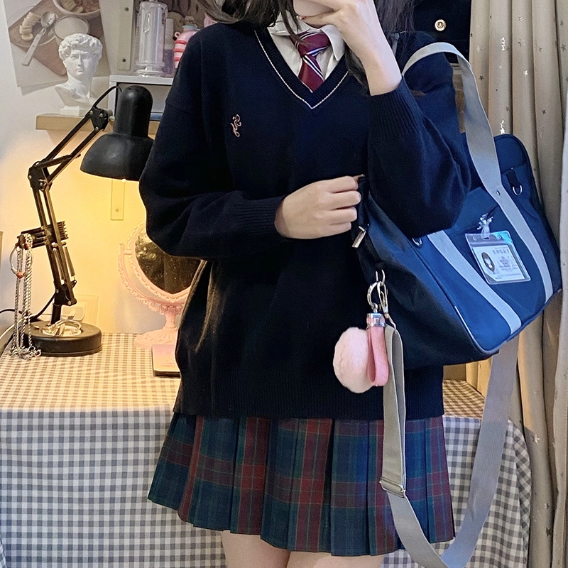 东鲸岁时记 经典学院风格纹百褶短款半身裙 圣诞红格