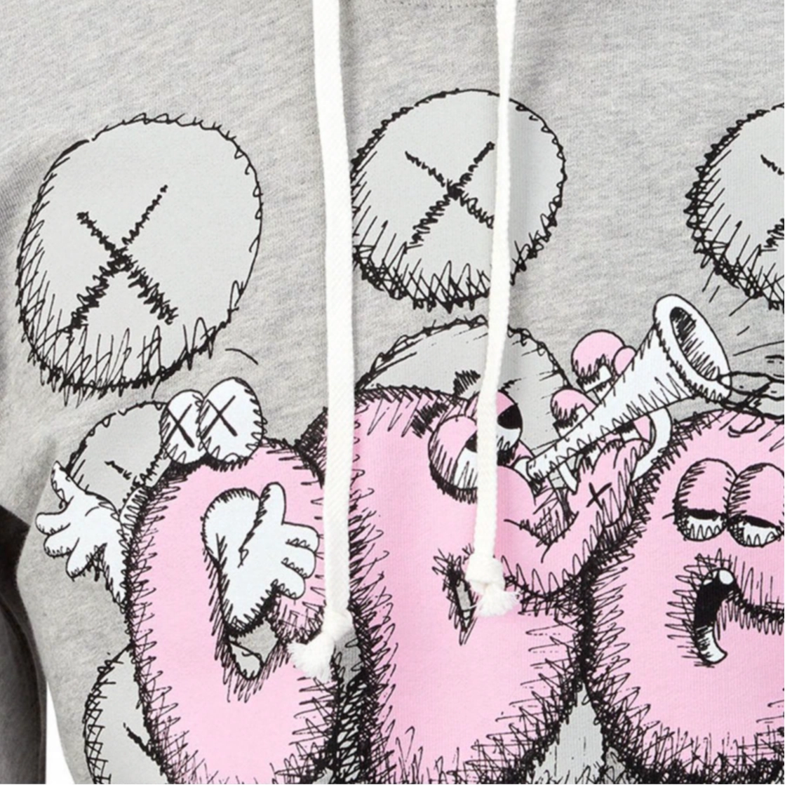 CDG x KAWS Logo