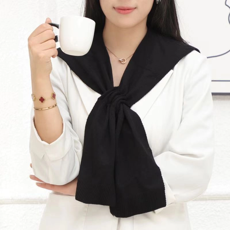 北极绒 针织外搭秋冬季韩版交叉洋气搭肩穿孔小坎肩 披肩 女款