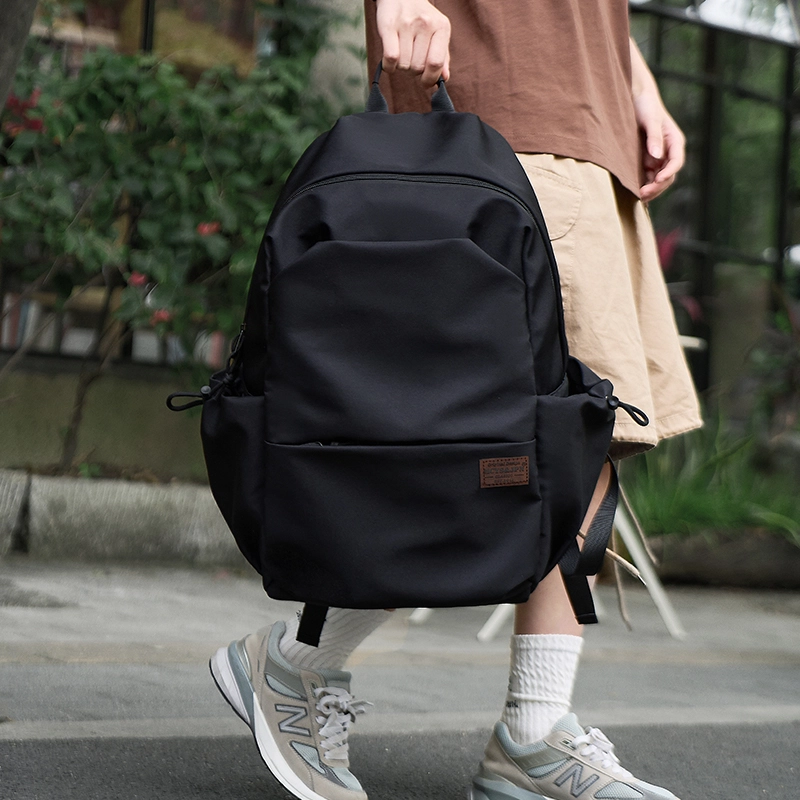 木村耀司  潮流百搭大容量大学生通勤休闲运动多口袋牛津纺电脑包双肩包 常规 男女同款情侣款  黑色/卡其色