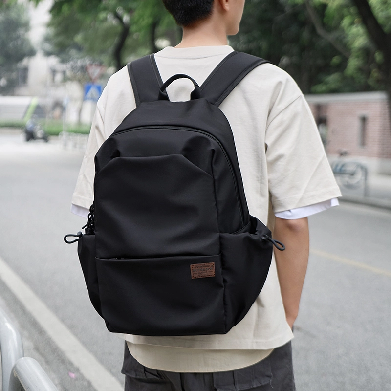 木村耀司  潮流百搭大容量大学生通勤休闲运动多口袋牛津纺电脑包双肩包 常规 男女同款情侣款  黑色/卡其色