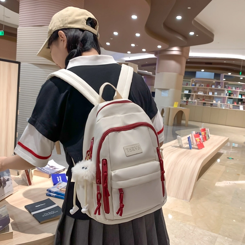 醇龙  尼龙男女通用多色书包大容量学生轻便减负护脊高颜值背包纯色多口袋双肩包