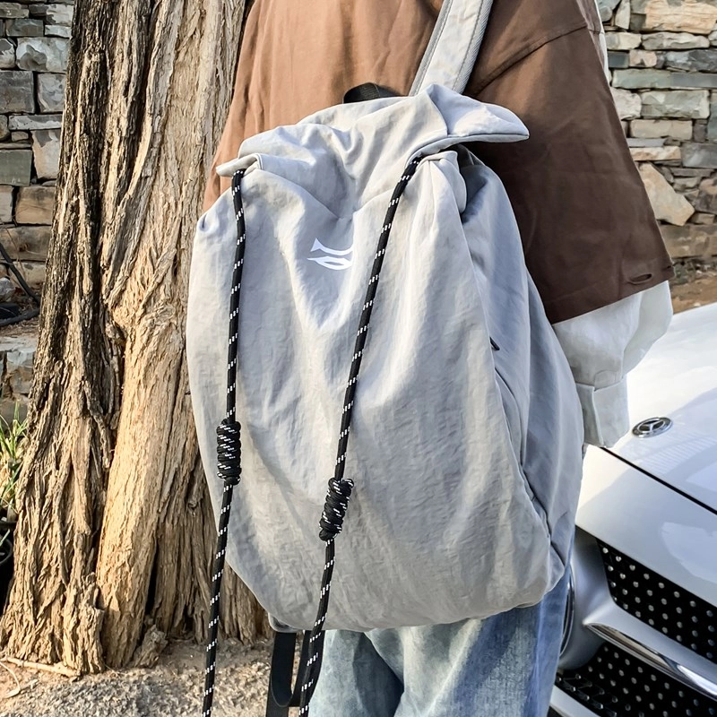 笛贝嘉 韩版简约大容量旅游背包抽绳纯色休闲运动学生书包 复合布 双肩包 男女同款情侣款 多色