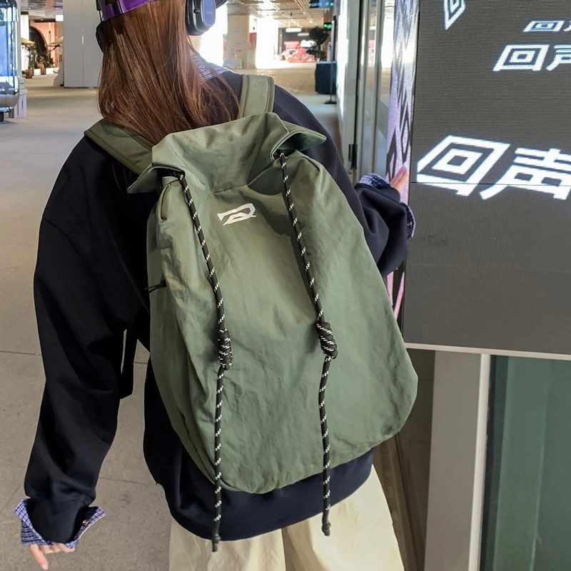 笛贝嘉 韩版简约大容量旅游背包抽绳纯色休闲运动学生书包 复合布 双肩包 男女同款情侣款 多色