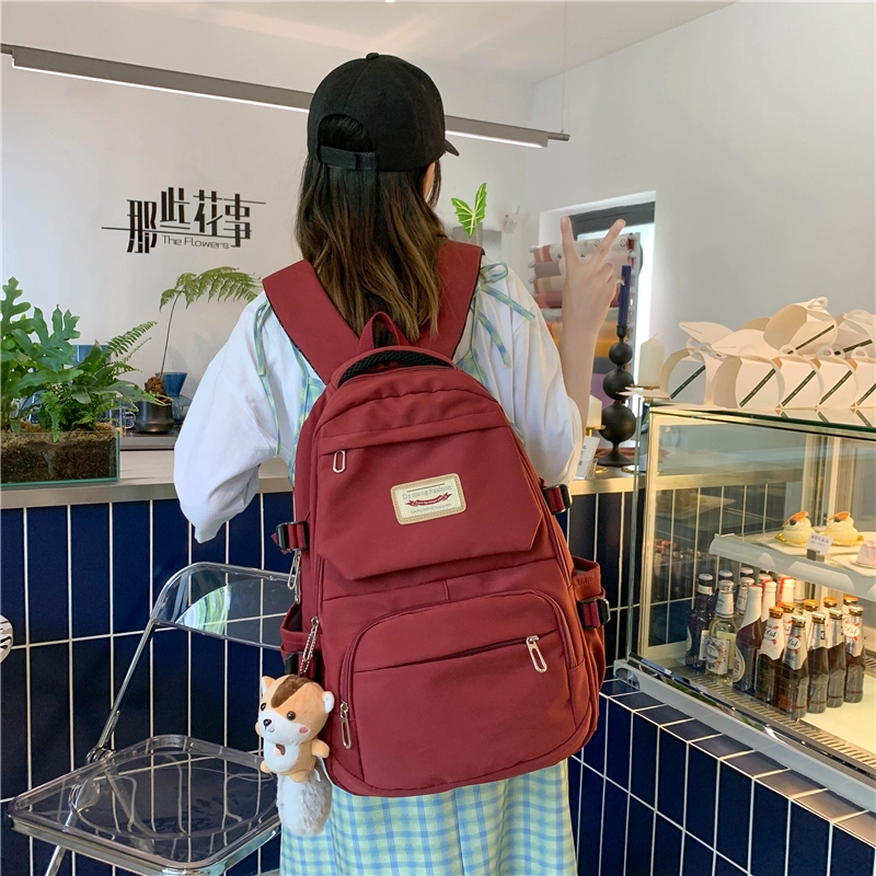 笛贝嘉 韩版简约纯色大容量学生书包复古百搭通勤 尼龙 双肩包 男女同款情侣款 多色