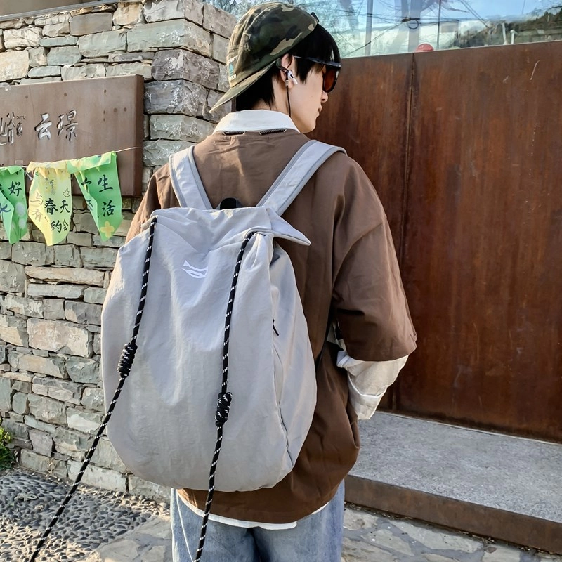 笛贝嘉 韩版简约大容量旅游背包抽绳纯色休闲运动学生书包 复合布 双肩包 男女同款情侣款 多色