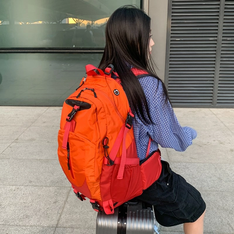 笛贝嘉 时尚简约轻便外出旅行 牛津布 双肩包 男女同款情侣款 桔红拼色