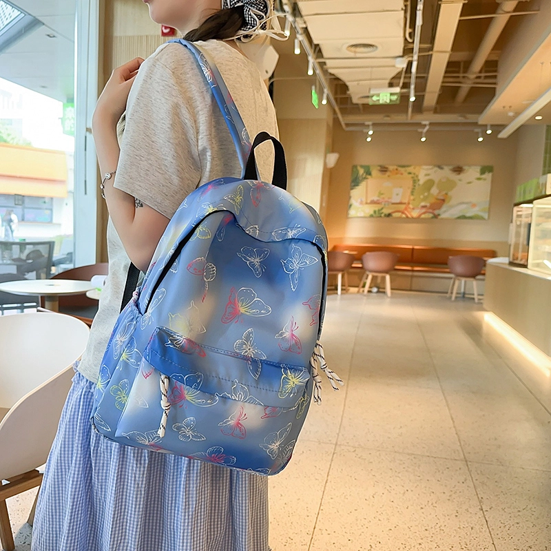 泰迪珍藏 学生书包时尚炫彩印花蝴蝶彩色背包小学初中大容量 尼龙 双肩包 女款 蓝色/紫色/黑色