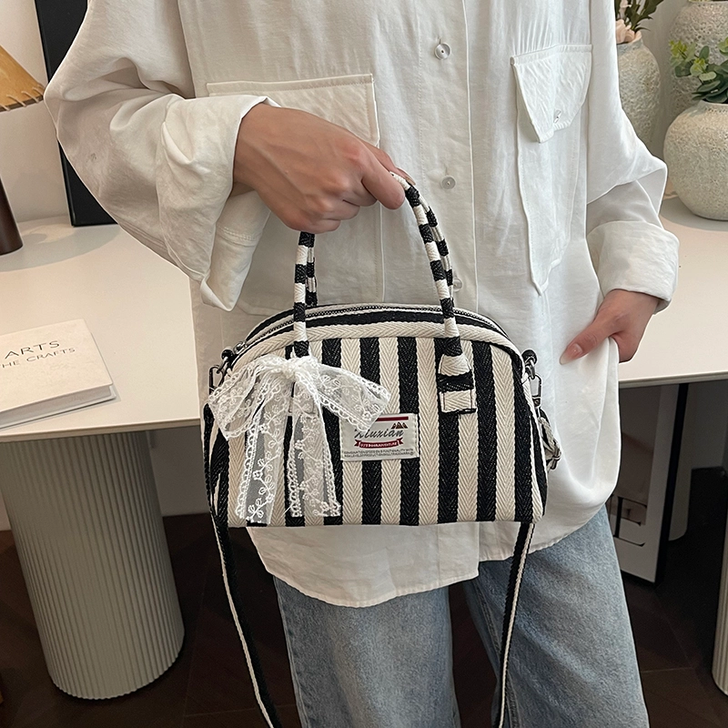 爱尔绅特 休闲拉链开合 帆布 帆布包单肩斜挎包 常规 女款 黑色/红色