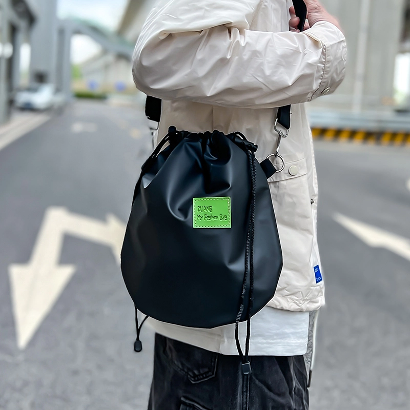 尼格尔 潮流抽绳超纤尼龙水桶包单肩斜挎包 男女同款 多色
