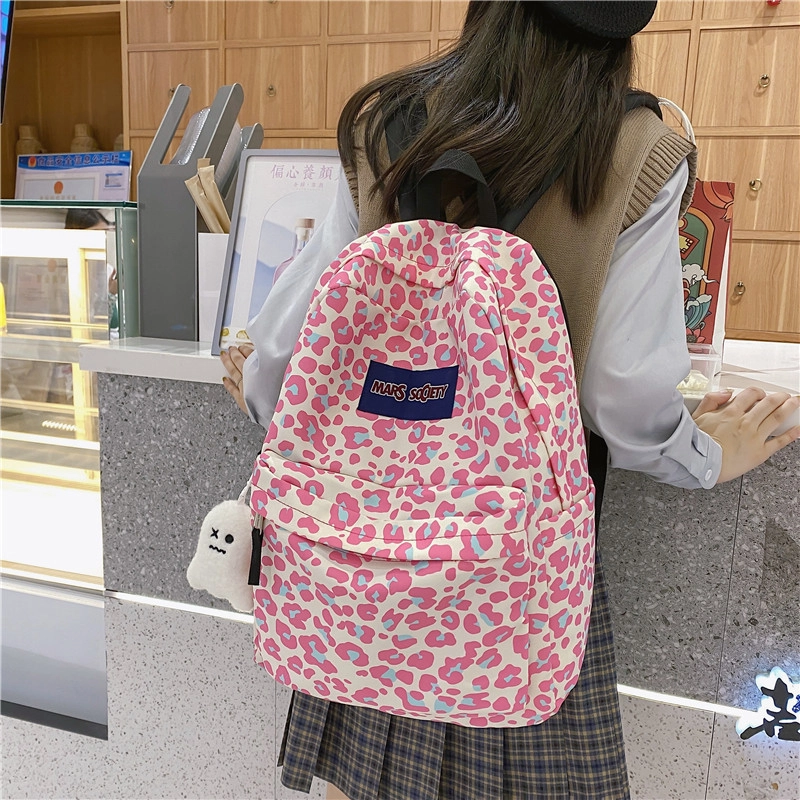 爱尔绅特 韩版原宿休闲街头潮流校园背包中小学生 尼龙 双肩包 男女同款情侣款 白色/黑色