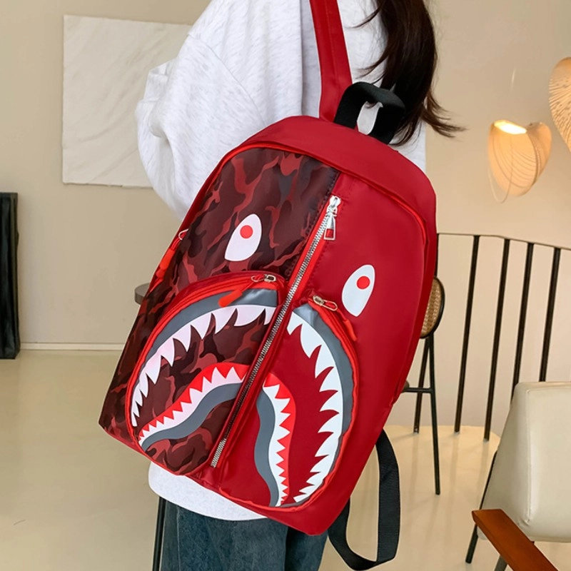 爱尔绅特 个性涂鸦鲨鱼学生休闲出行时尚潮流 尼龙 双肩包 男女同款情侣款 多色